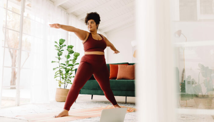 Healthy woman doing exercise at home