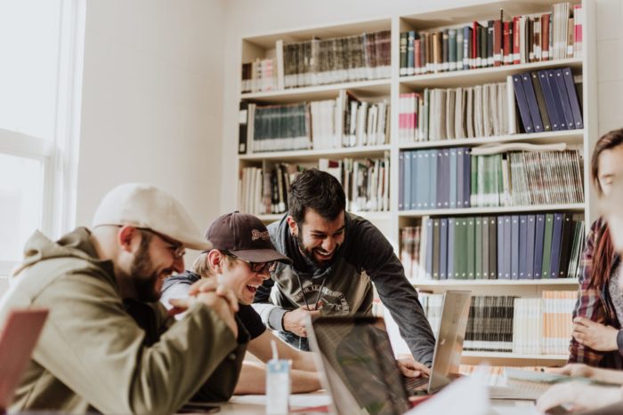 college kids working together in library