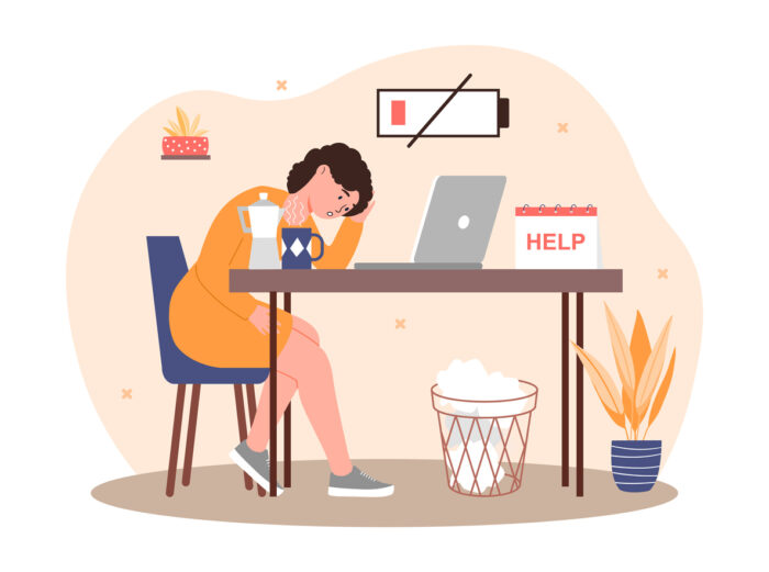 Work burnout concept, Tired woman sitting at her laptop and with a low battery image above her head