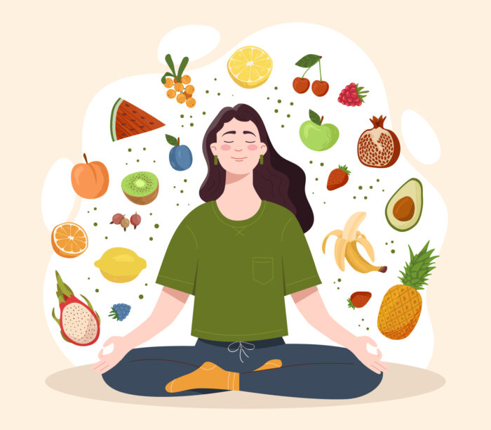 Mindful eating concept, person sitting cross legged on the floor with images of different fruit around them