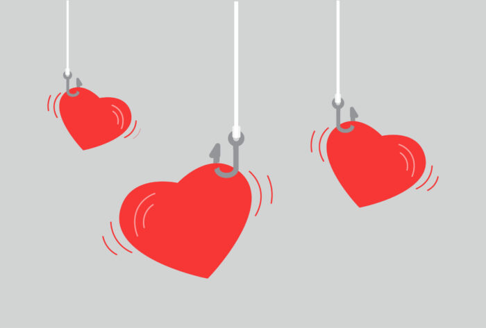 3 individual red hearts dangling on a hook