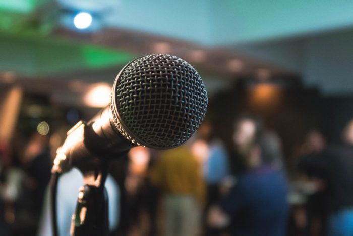 microphone with blurry audience