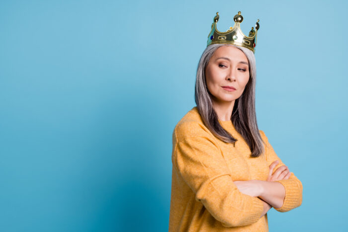 Photo of stunning gorgeous elegant senior lady arrogant look smug smile crown head watching servants clean house wear yellow jumper bright blue color background