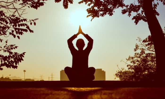 silhouette of a yoga pose outside